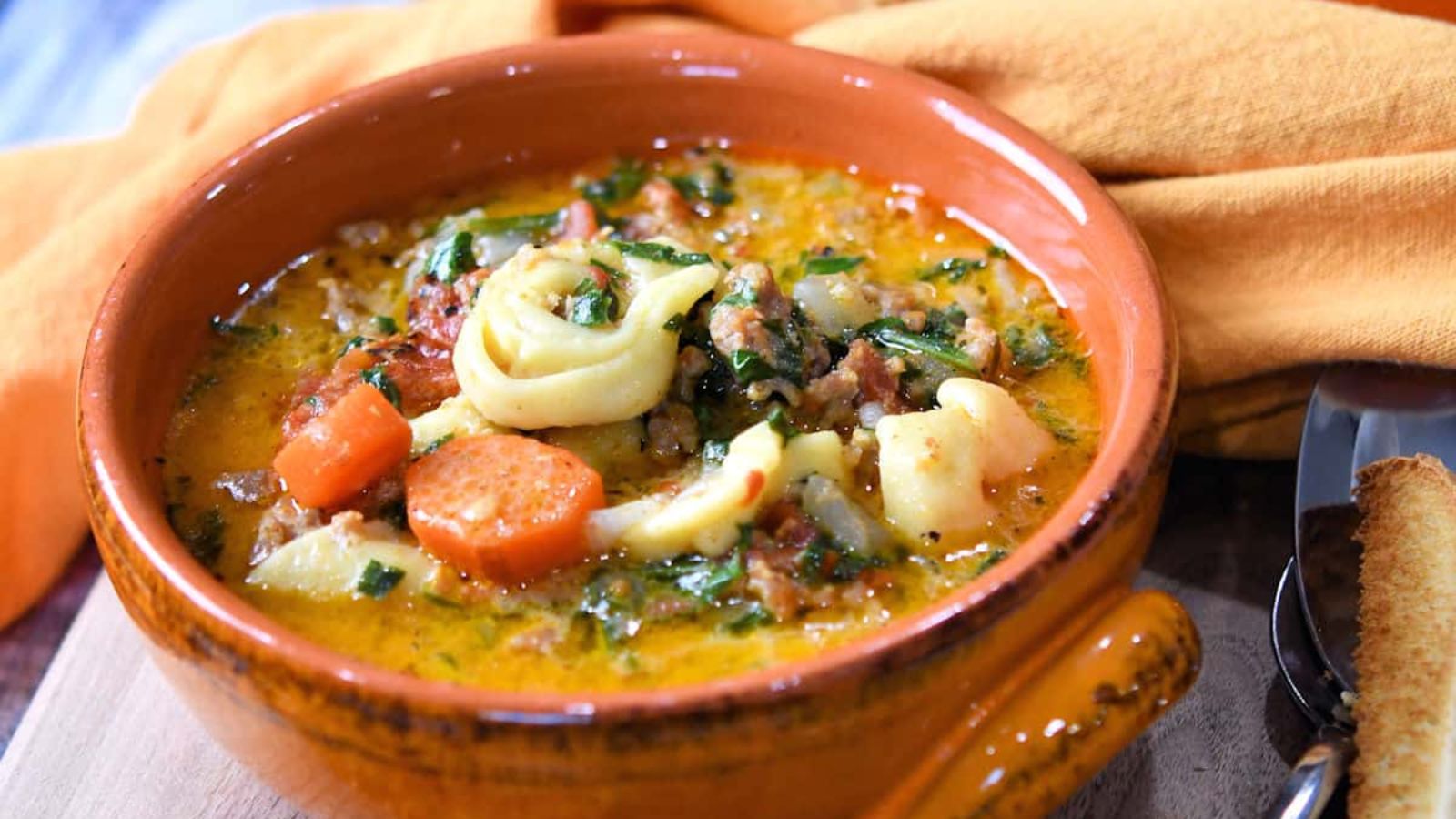 Tortellini soup in a bowl.