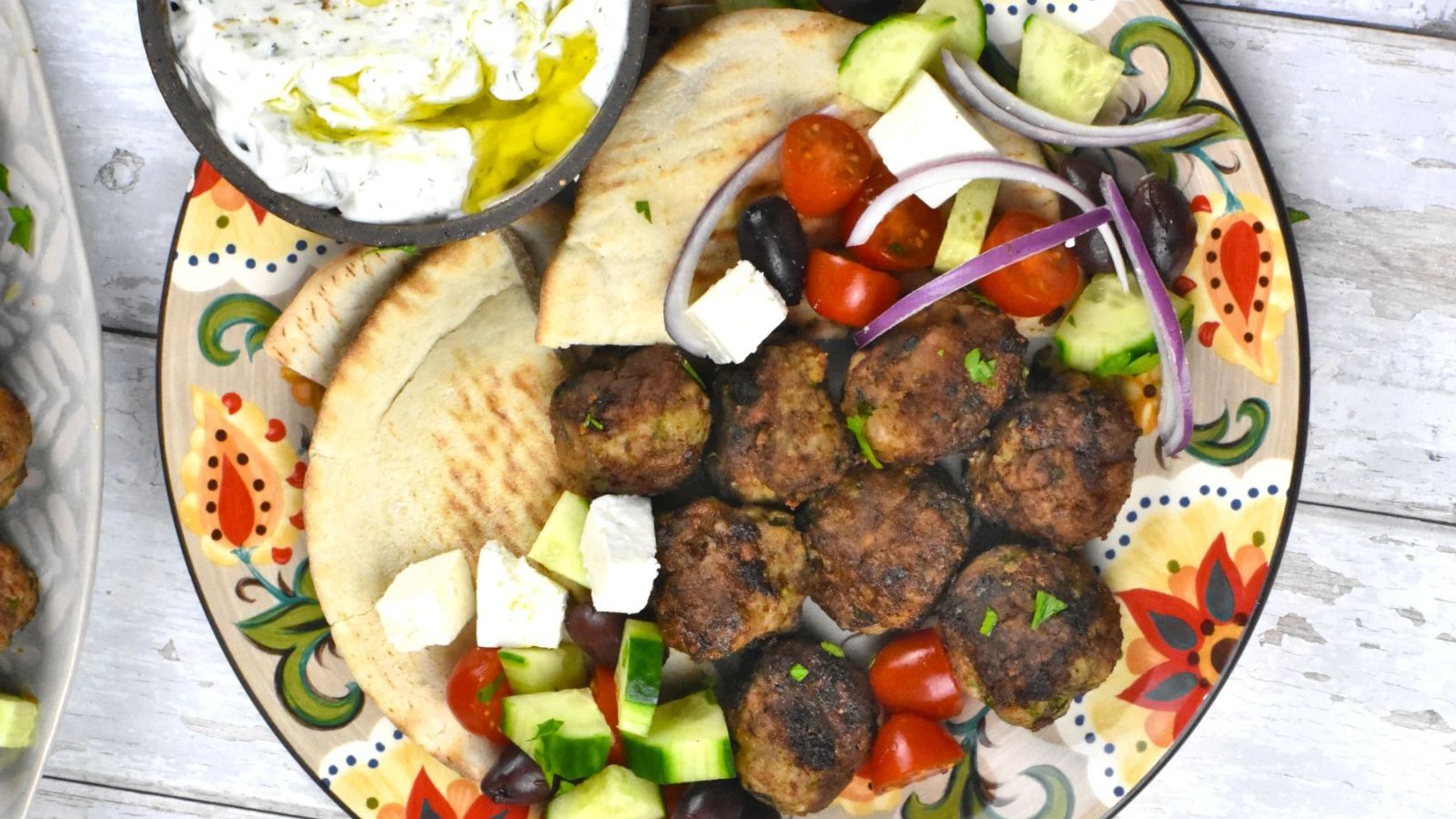 Meatballs with dip and wraps on the side.