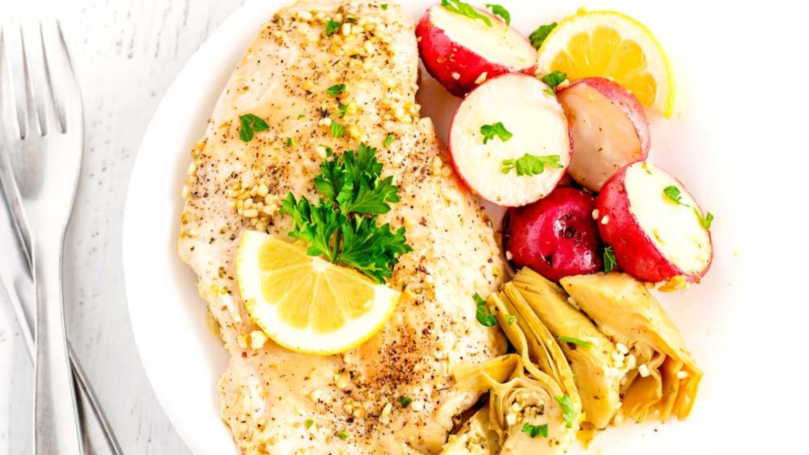 Lemon chicken with potatoes and artichokes.
