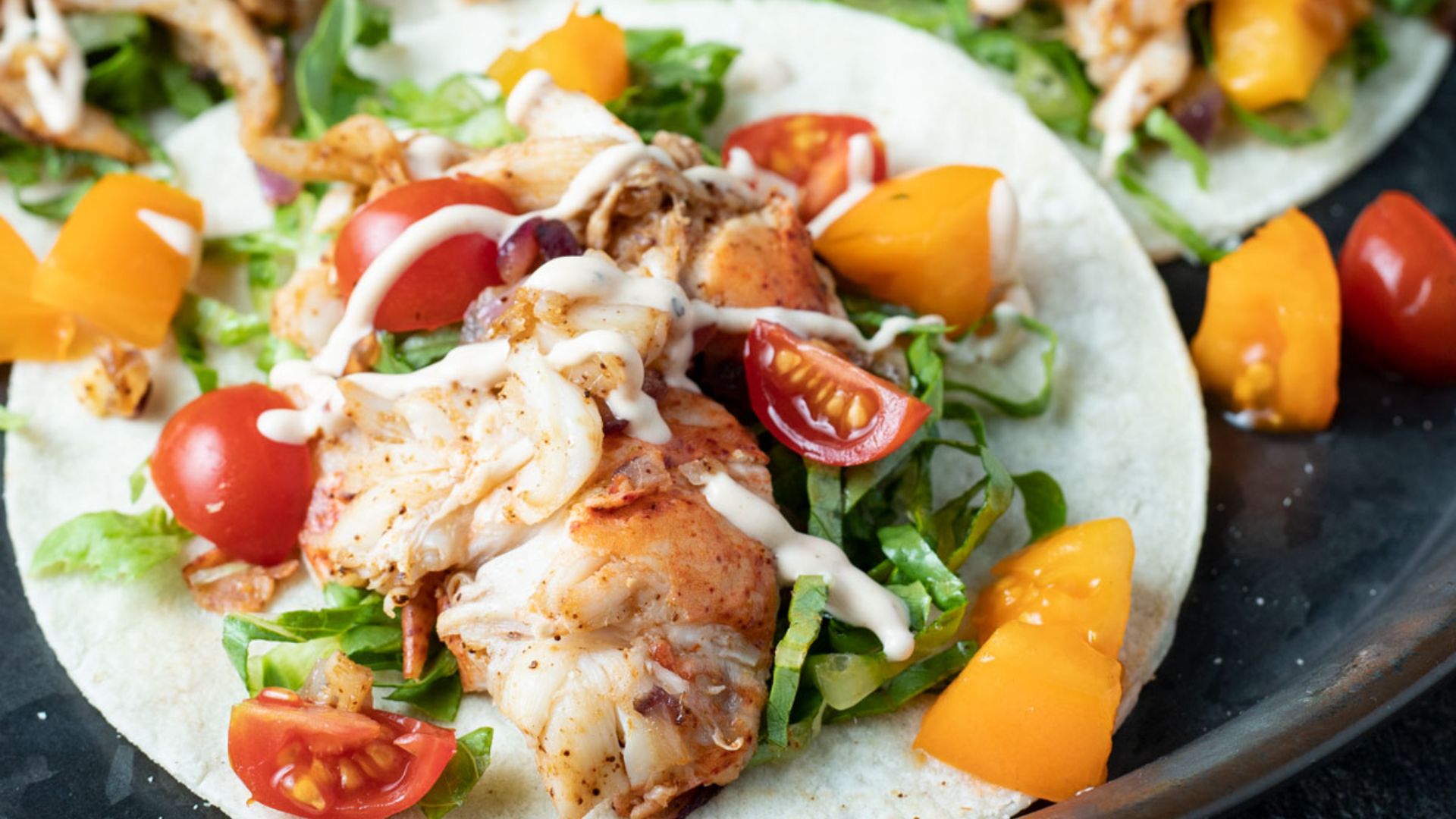 Close up of a taco loaded with lobster meat.