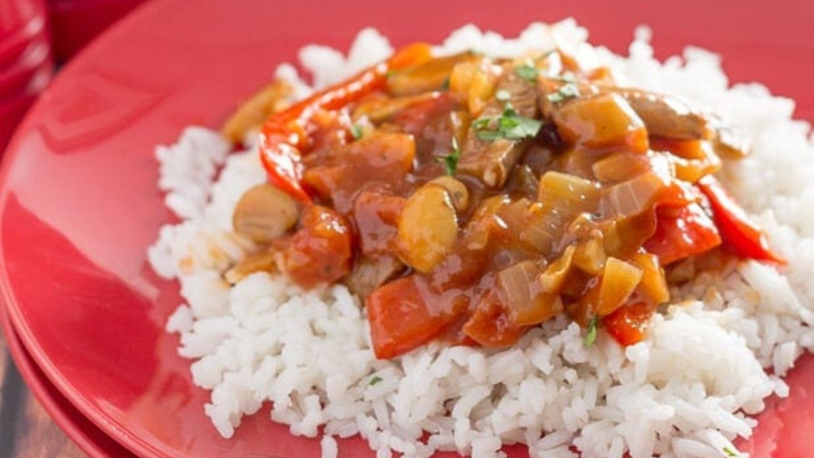 Venison sausage casserole on top of white rice.