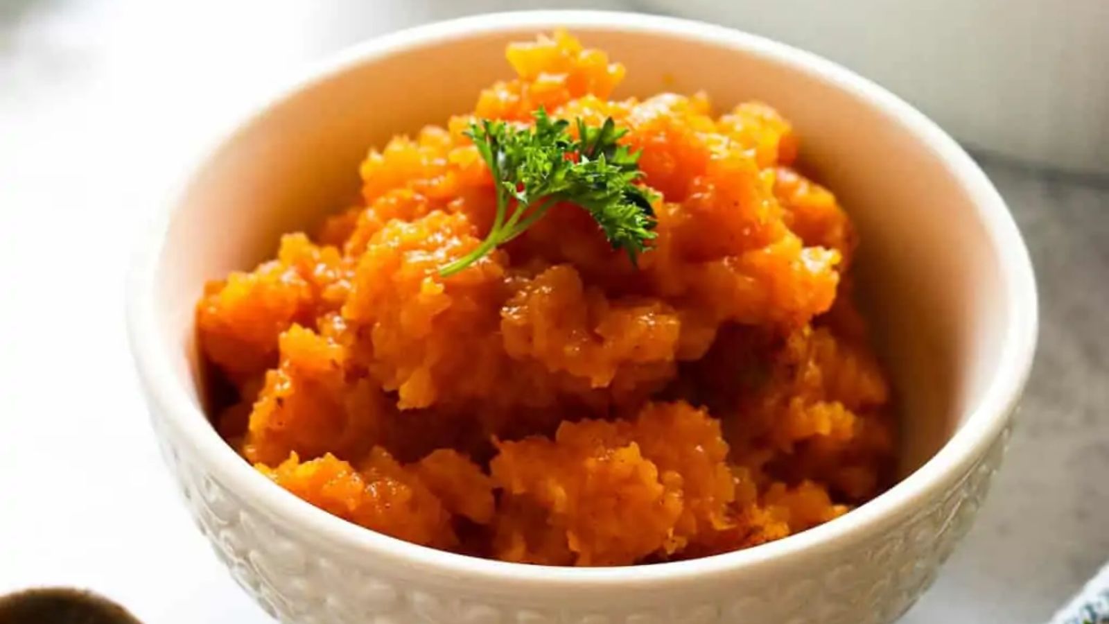 Mashed butternut squash in a bowl.