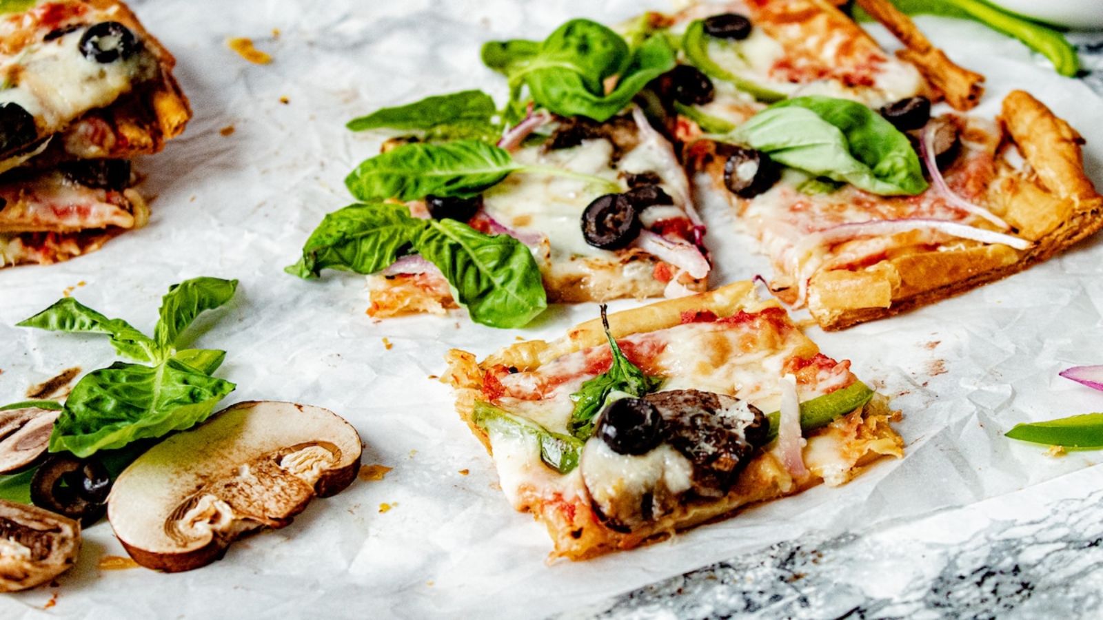 Puff pastry pizza with olives.