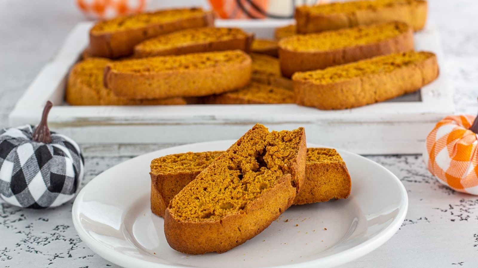 Pumpkin biscotti on a plate.