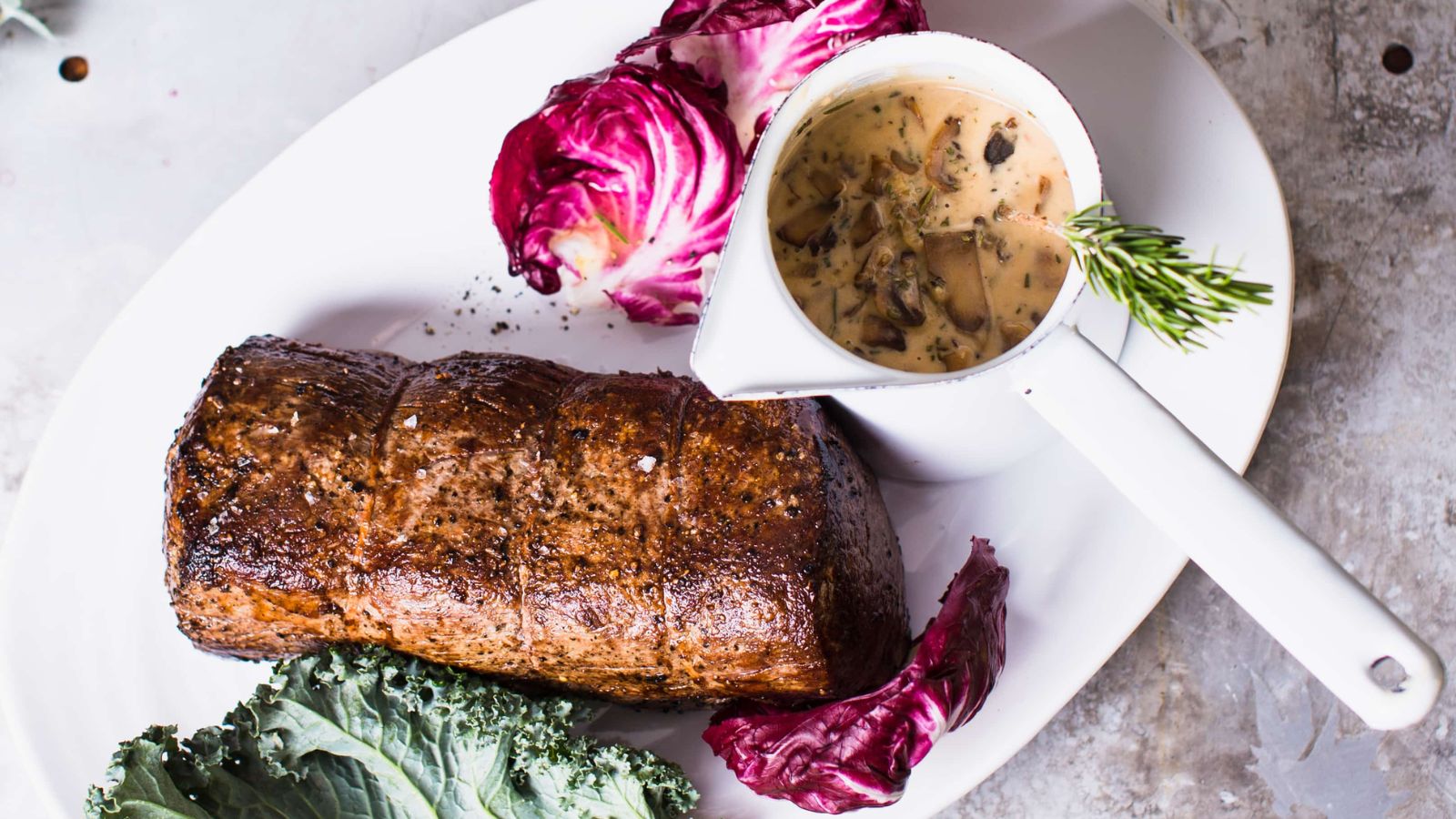 Beef tenderloin with mushroom cream sauce.