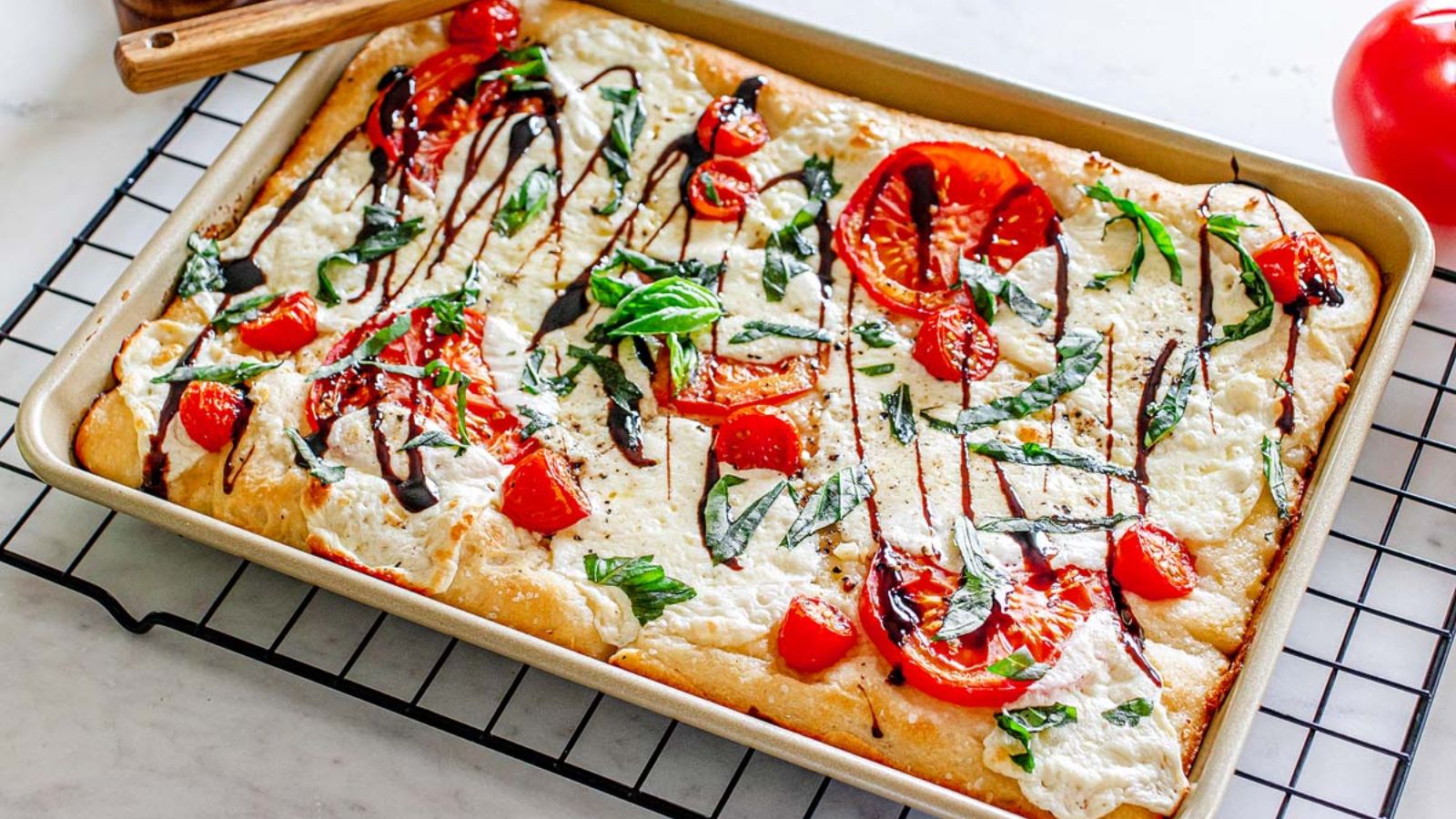 Whole sheet pan caprese pizza.