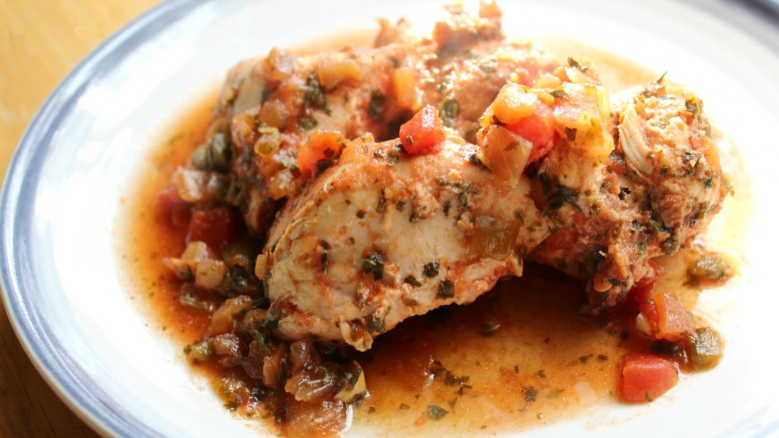 Salsa chicken on a plate.
