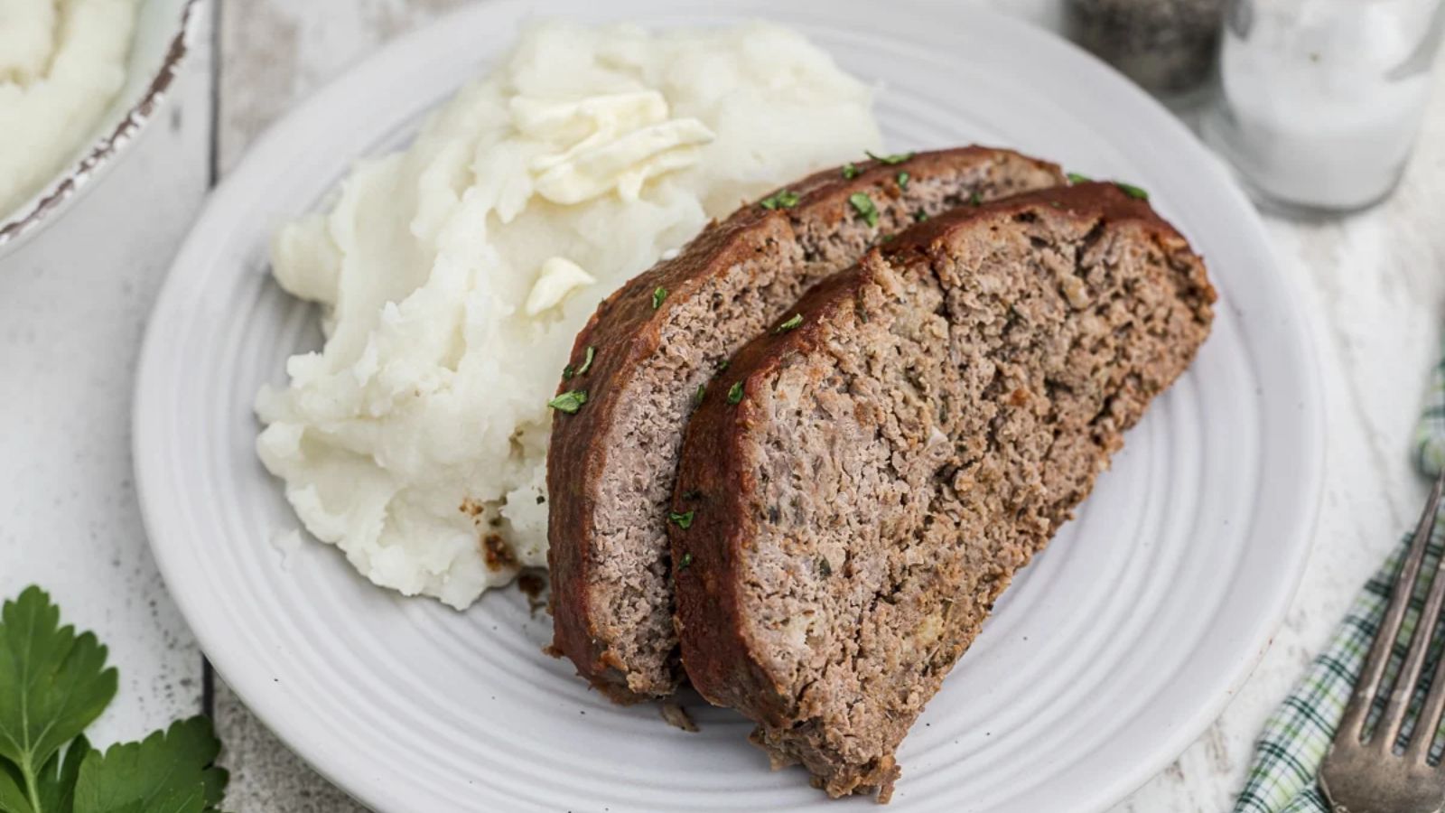 Two slices of venison meatloaf.