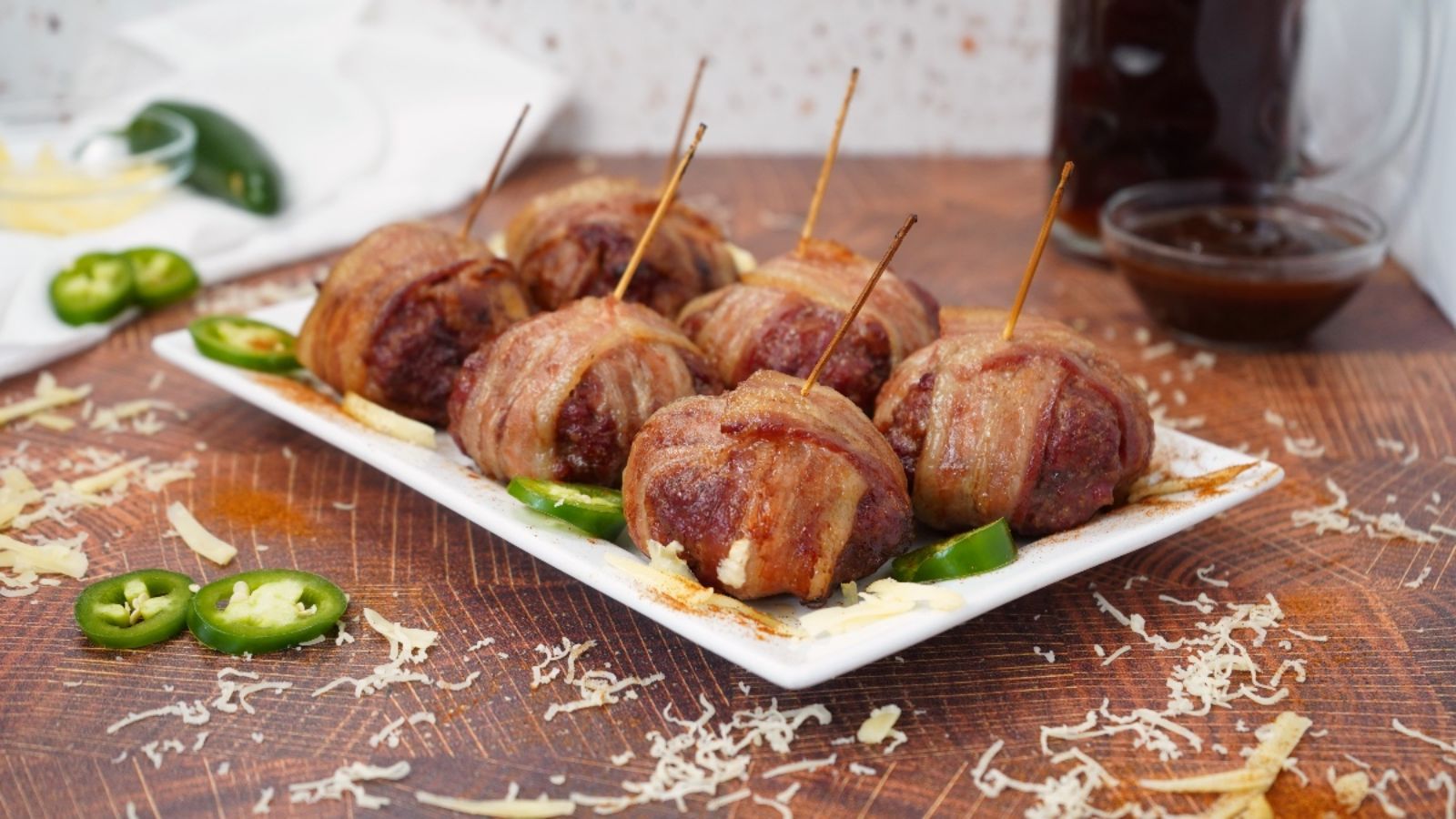 Bacon wrapped meatballs on a plate.