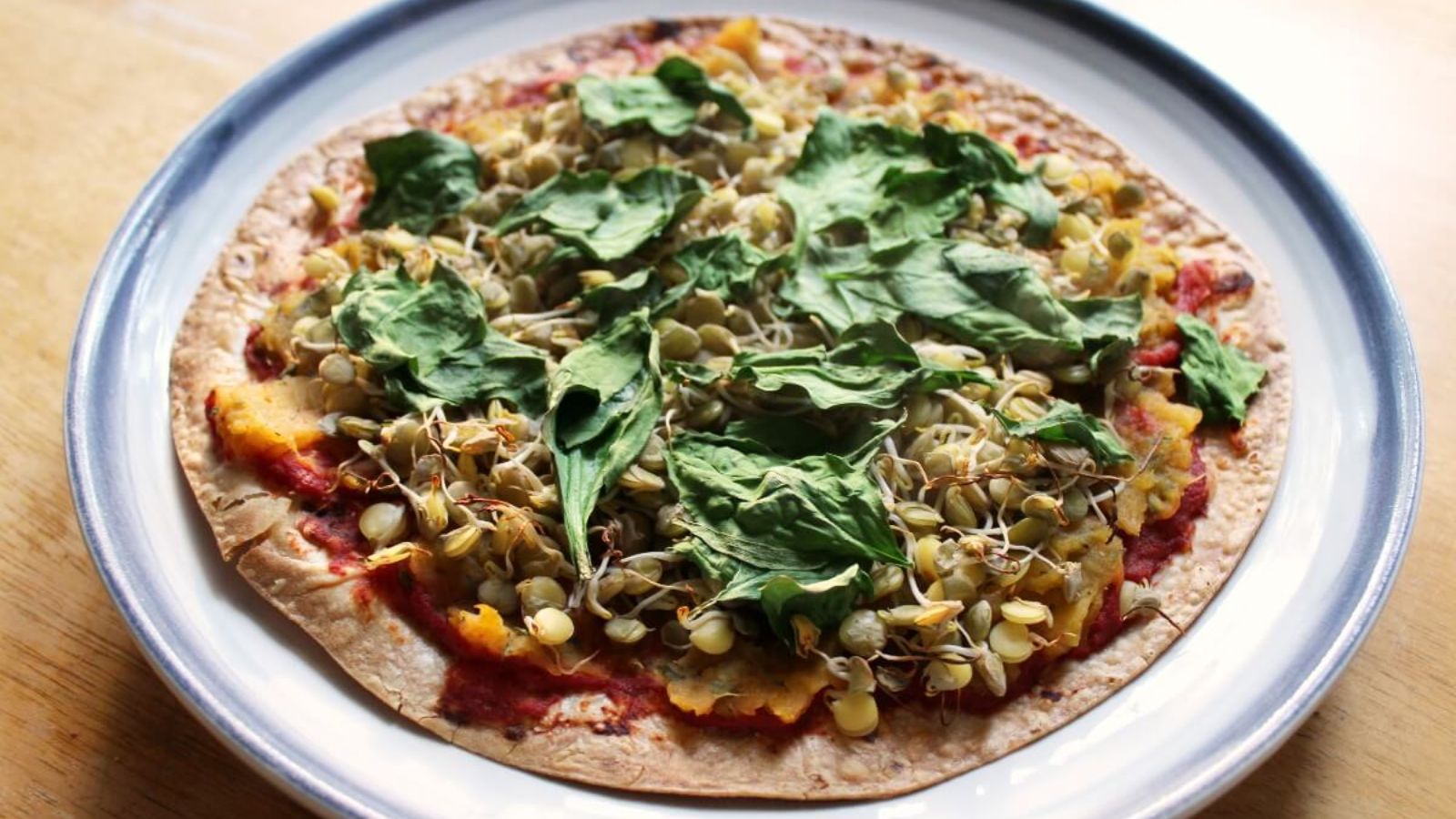 Lentil butternut squash pizza in a bowl.