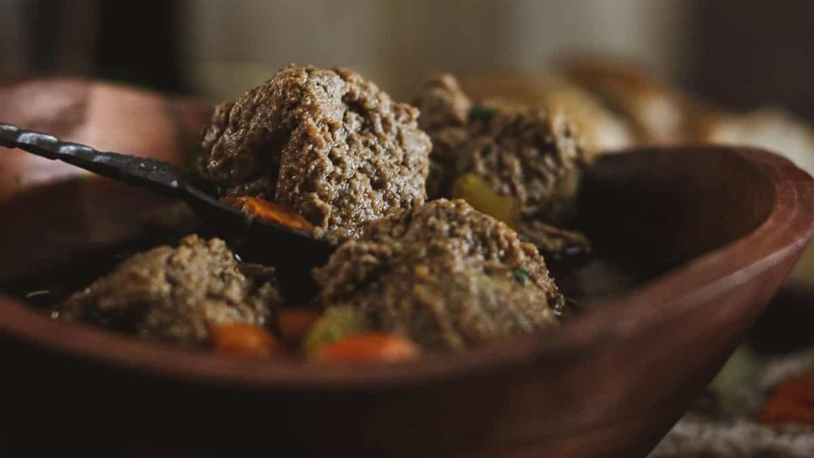 Liver dumpling soup in a bowl.
