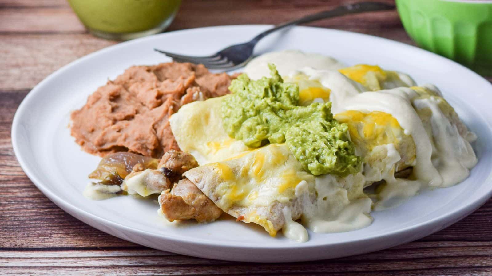 Chicken enchiladas on a plate.