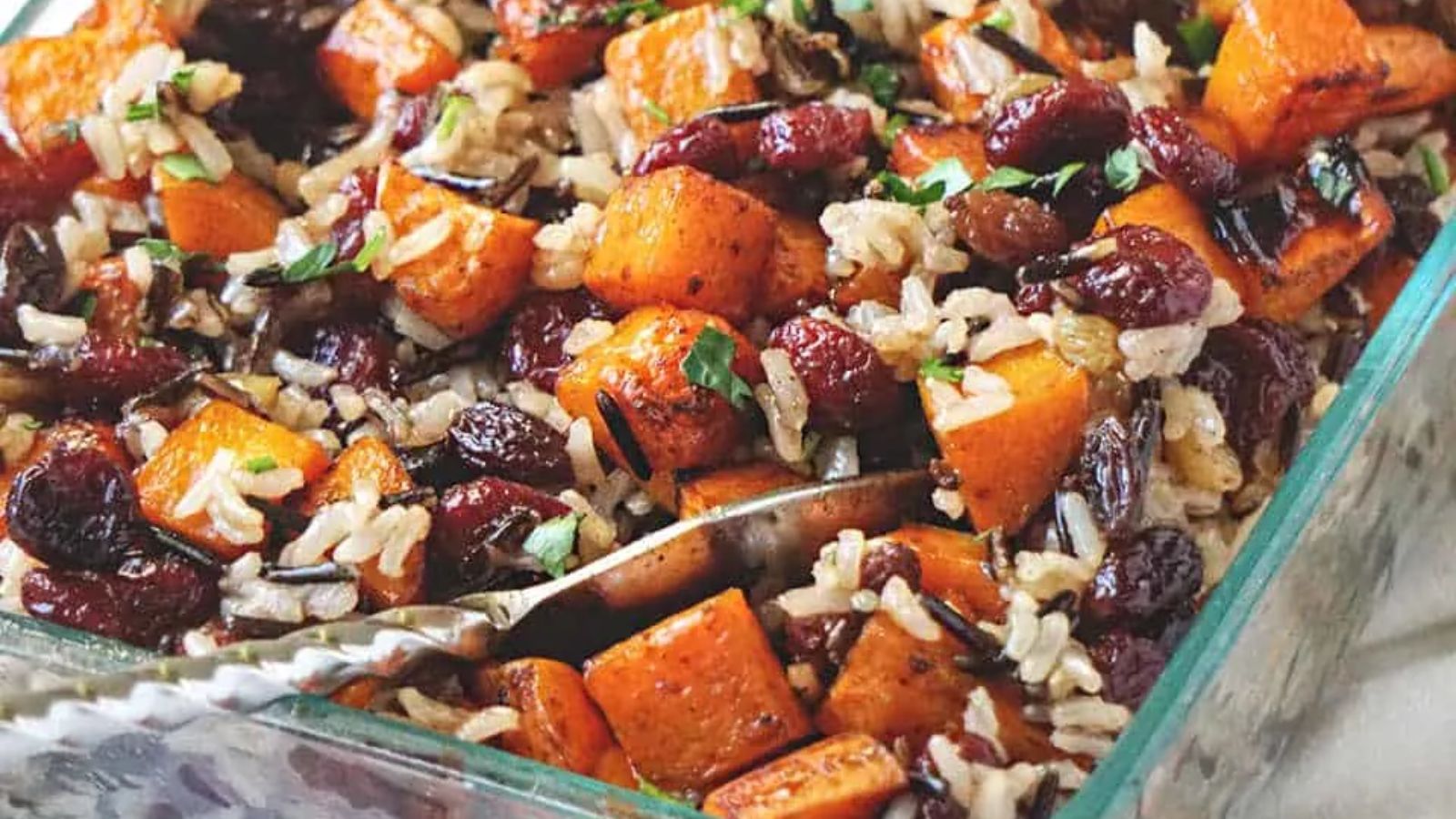 Butternut squash casserole on a glass tray.