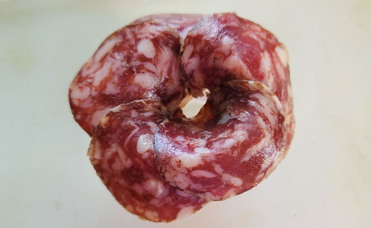 About 20 pieces of salami on the shot glass.