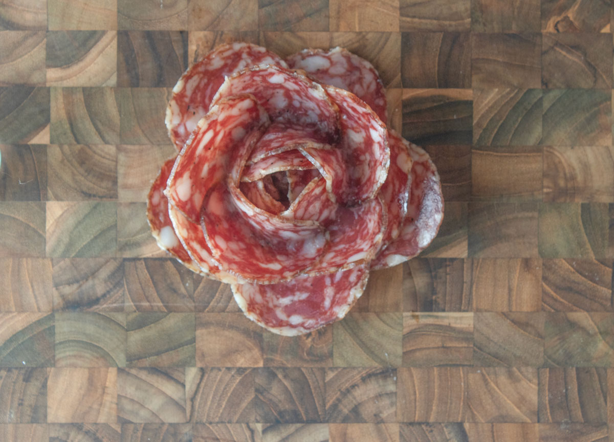 Meat rose on a wooden board.