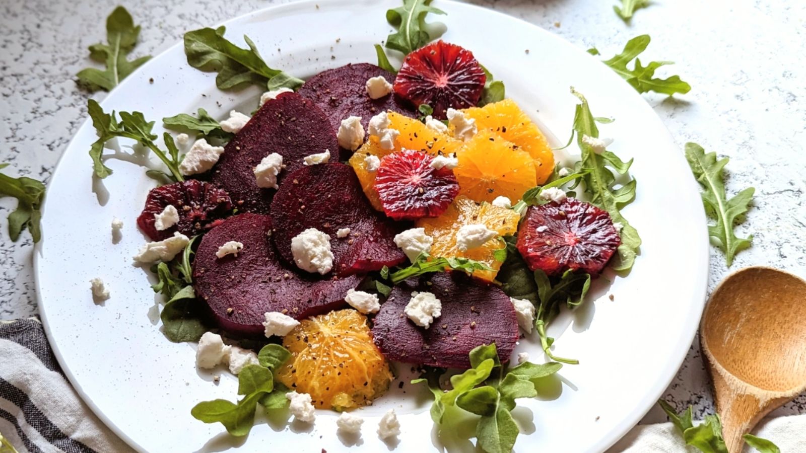Beet nad orange salad on a plate.