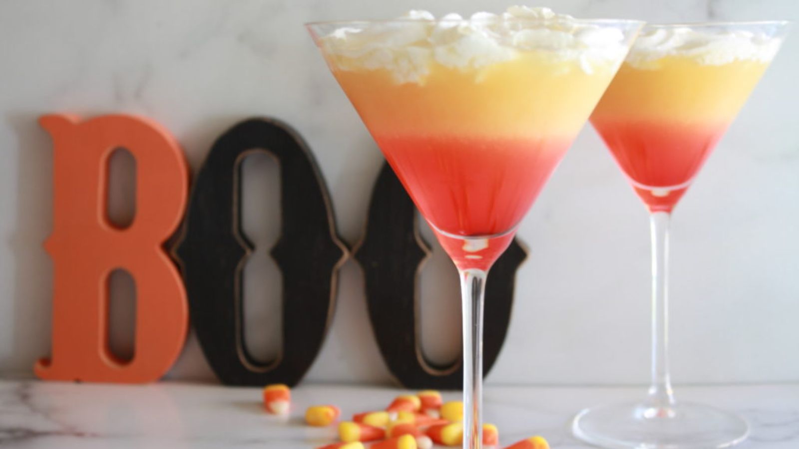 Candy corn martini in martini glasses.