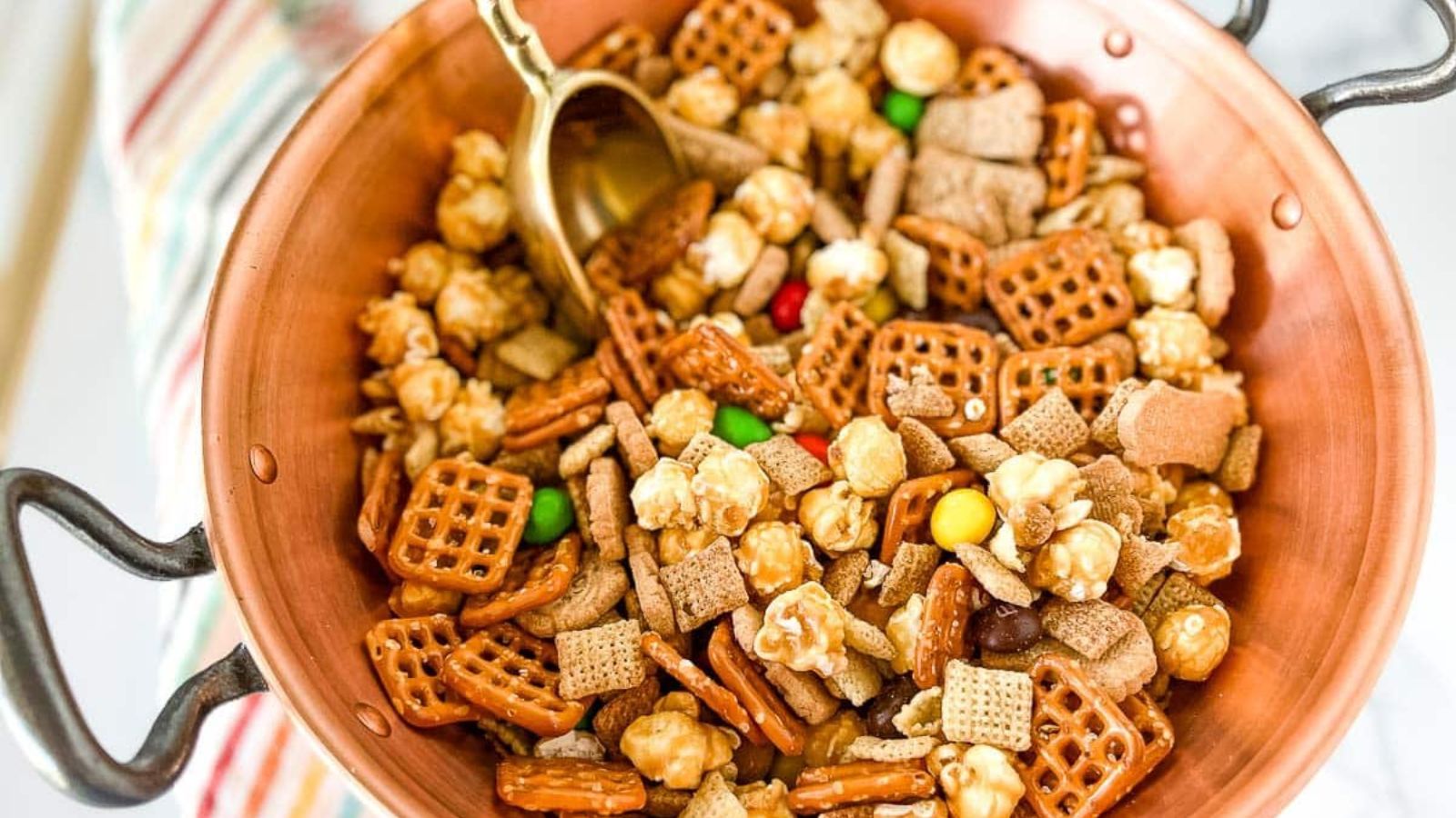 Party chex mix in a pan.