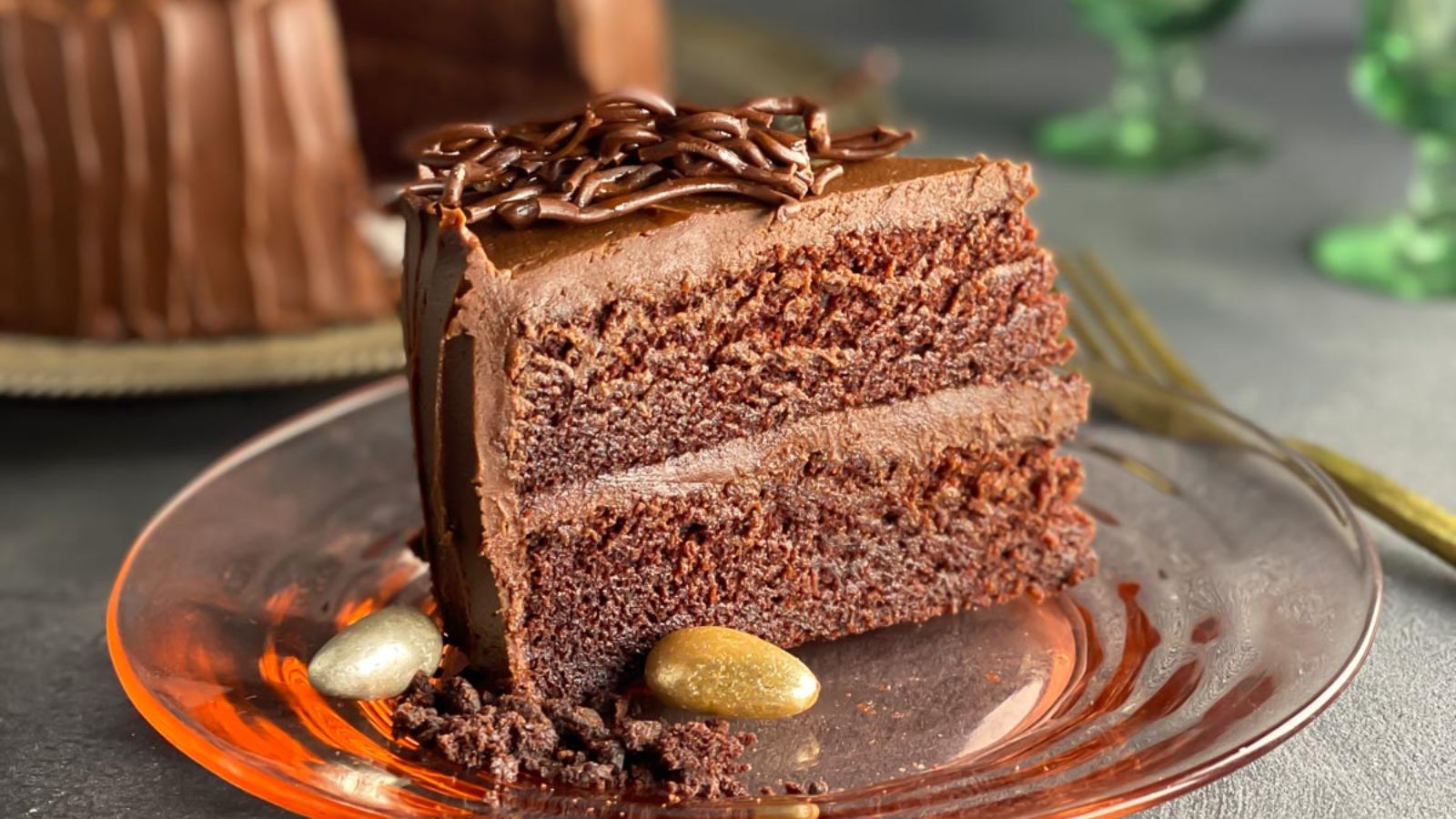 A slice of chocolate cake with mocha frosting.
