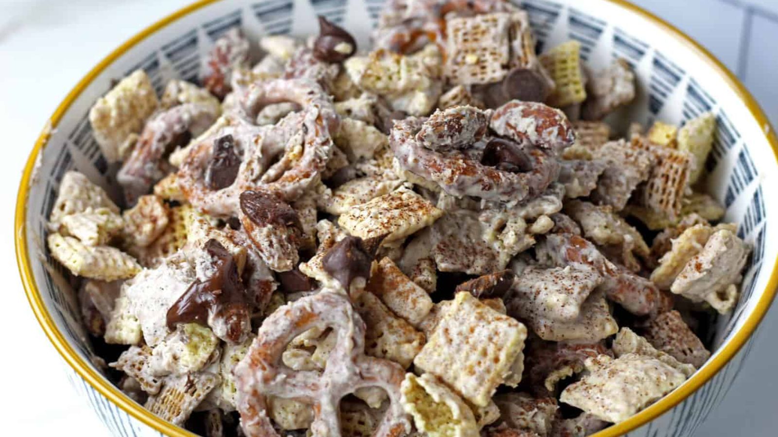 Churro chex mix in a bowl.