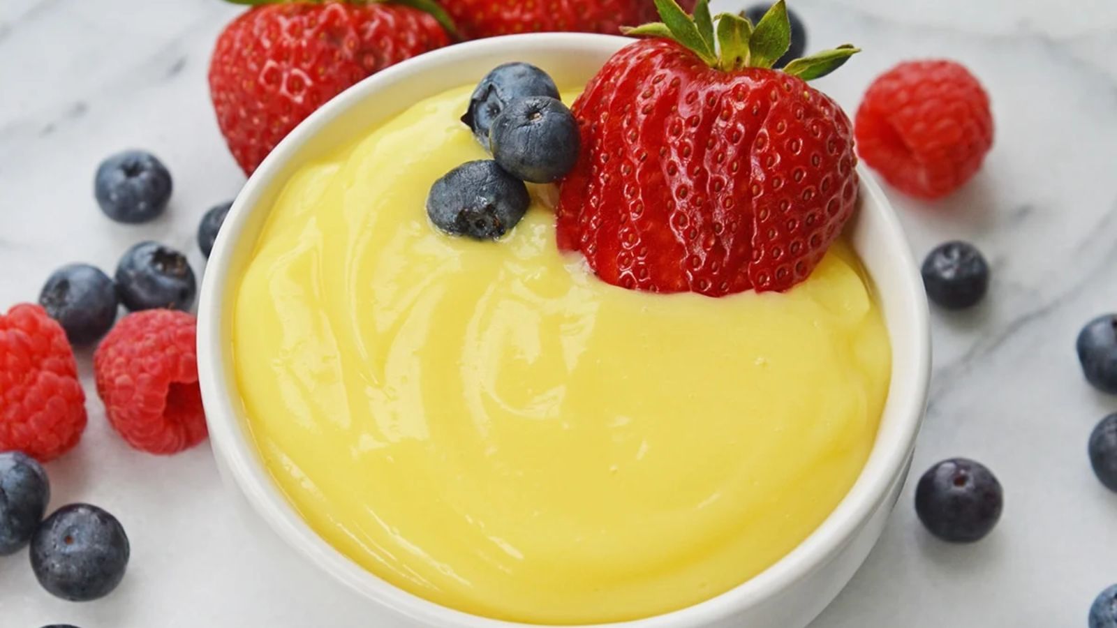 Vanilla custard with dipped strawberry.