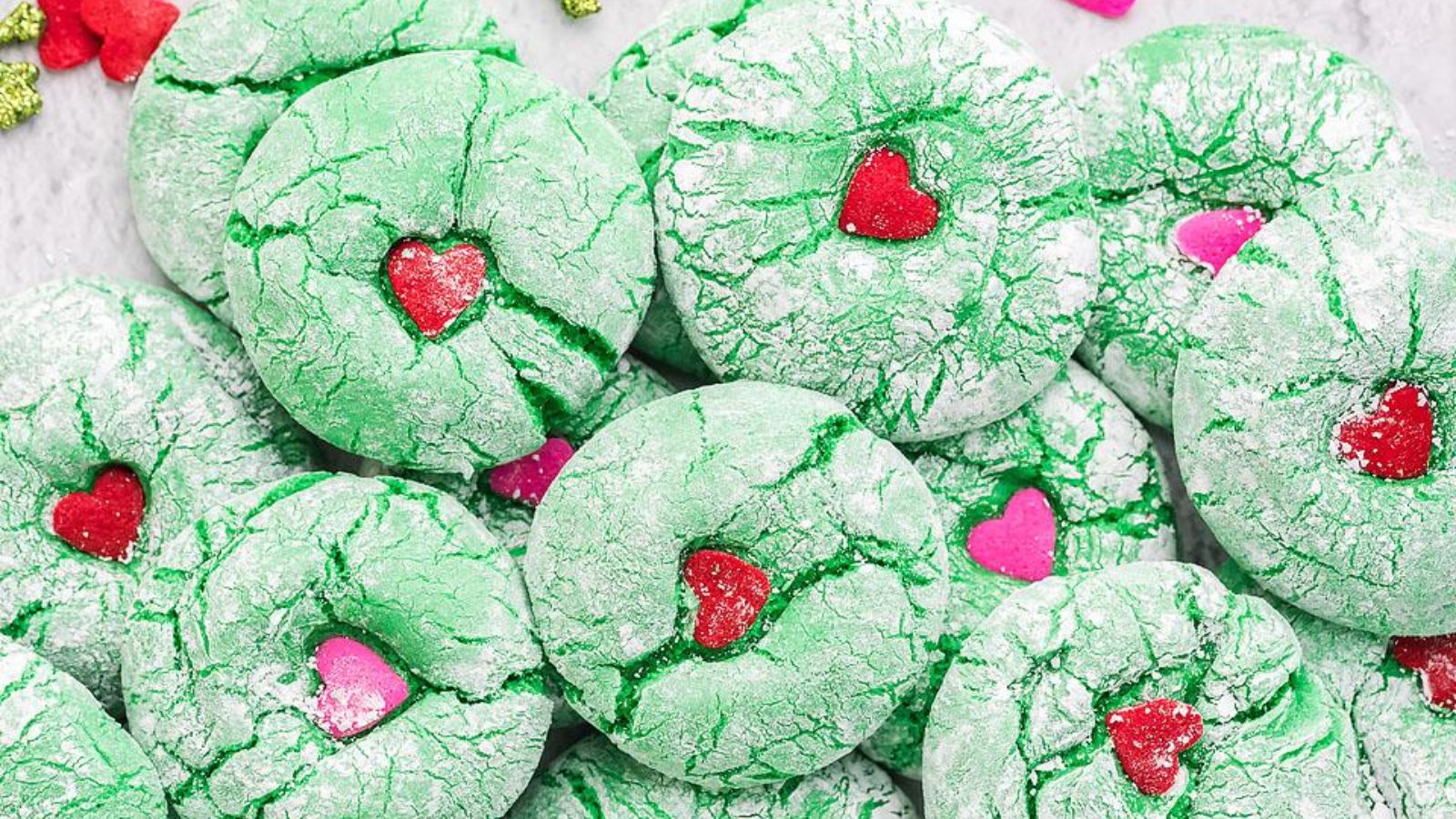 Green cookies with red hearts.