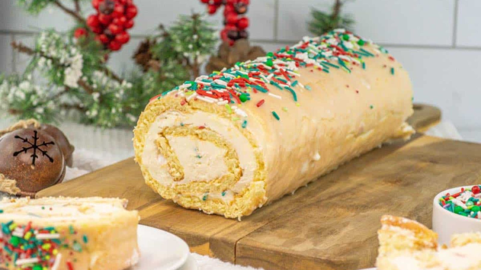 Christmas cake roll on a wooden board.