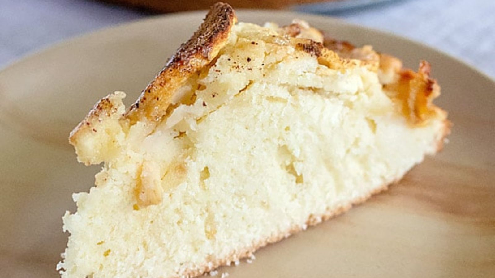 A slice of apple cake on a plate.