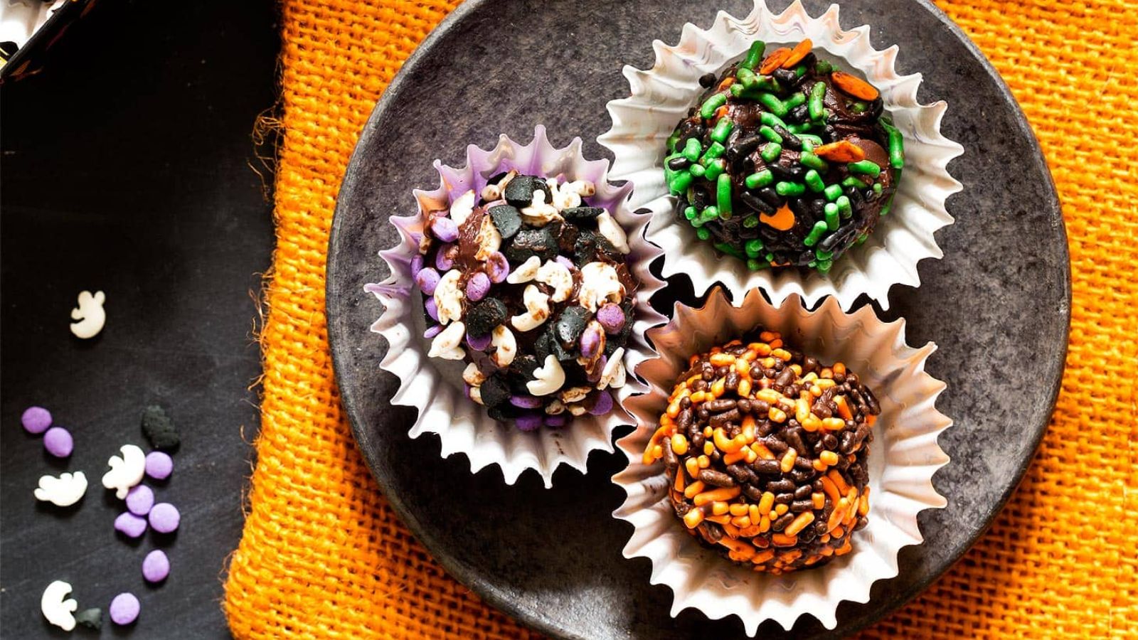 Halloween truffles on a plate.
