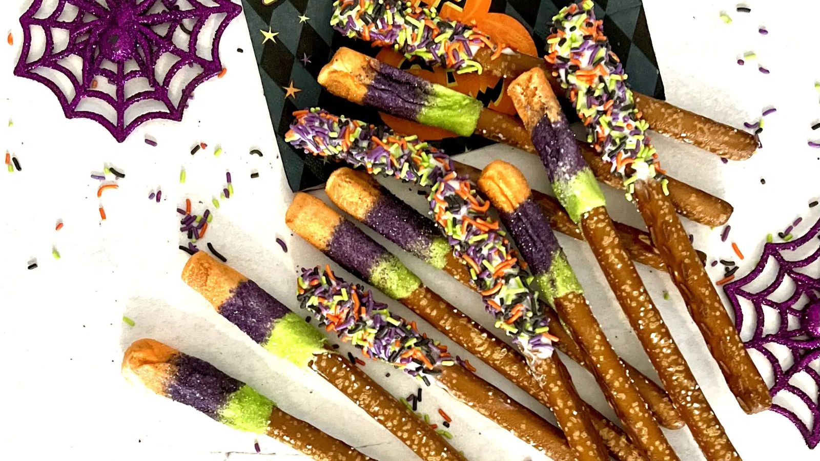 White chocolate covered pretzels with spinkles.