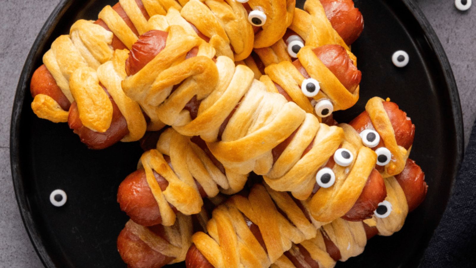 Halloween mummy hotdog on a plate.