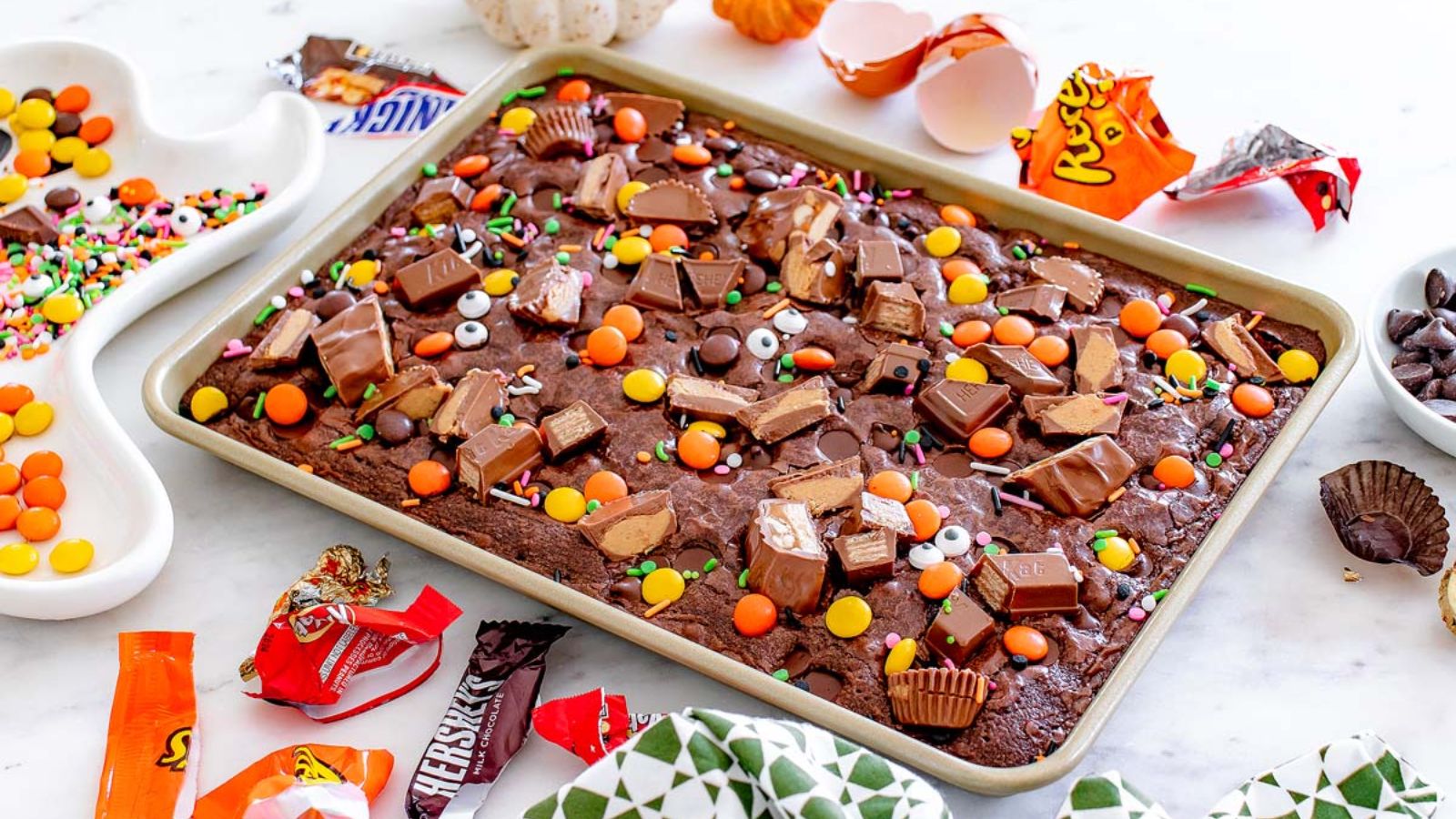 Halloween candy brownies on a tray.