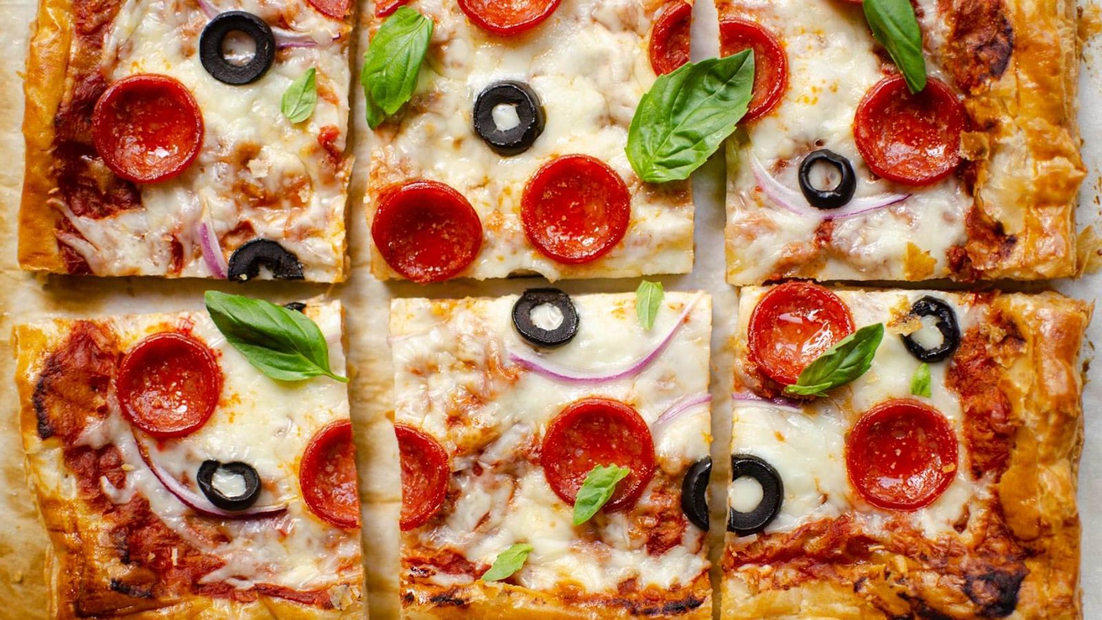 Puff pastry pizza with olives.