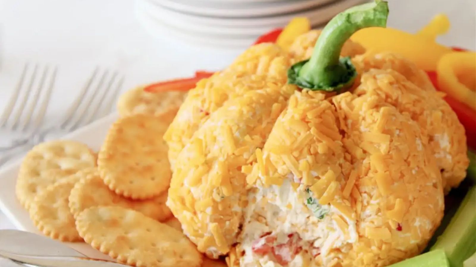 Pumpkin shaped cheeseball.