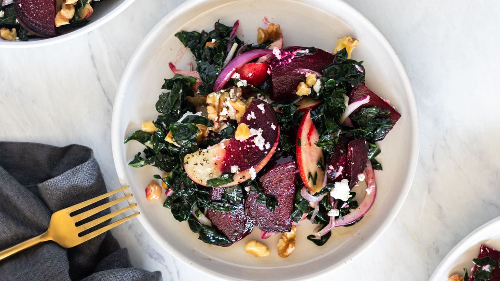 Kale and beet salad in a bowl.