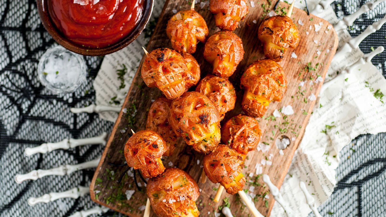 Skull potatoes with dip on the side.
