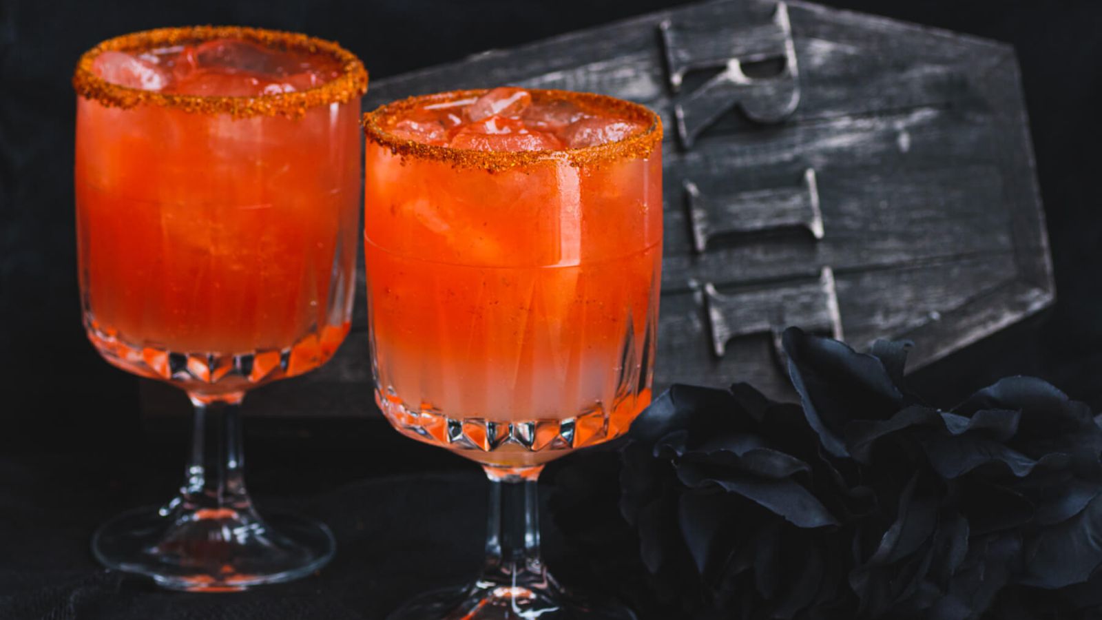 Two cocktails in glasses.
