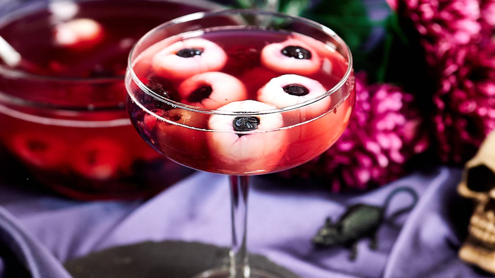 Witches brew eyeball punch in cocktail glass.