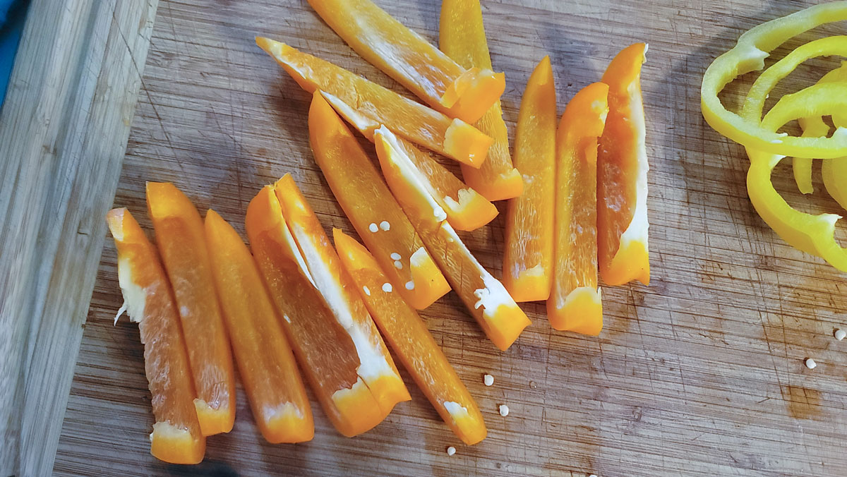 Pepper halves cut into strips.
