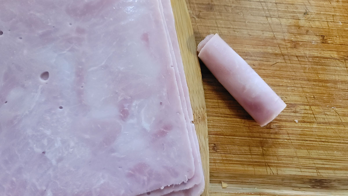 Piece of ham rolled into a log.