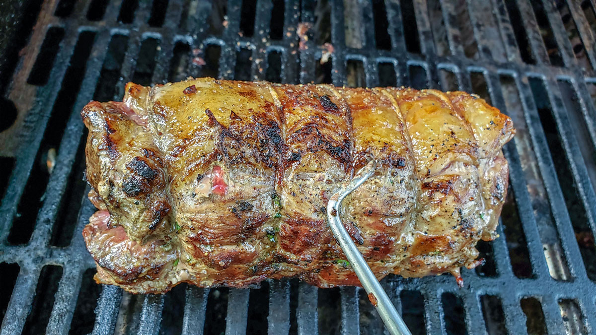 Searing the roast on the grill.
