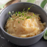 Mashed potato squash in a gray bowl.