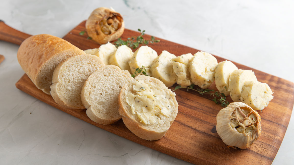 Sliced French bread slathered with roasted garlic butter.