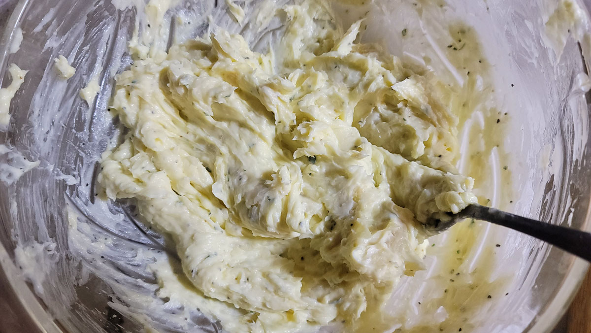 Roasted garlic butter mixed up in a bowl.