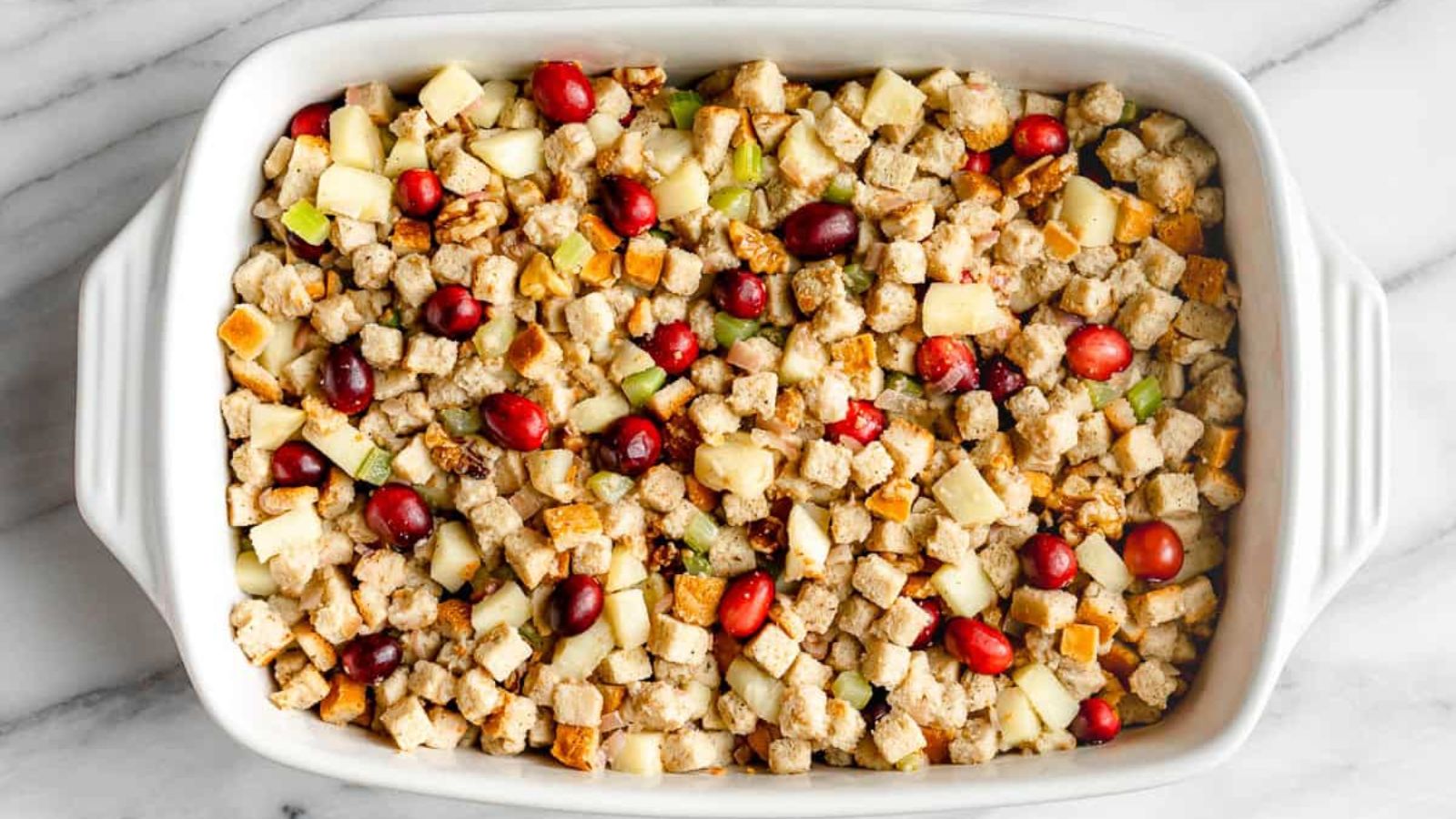 Apple and cranberry walnut stuffing on a tray.