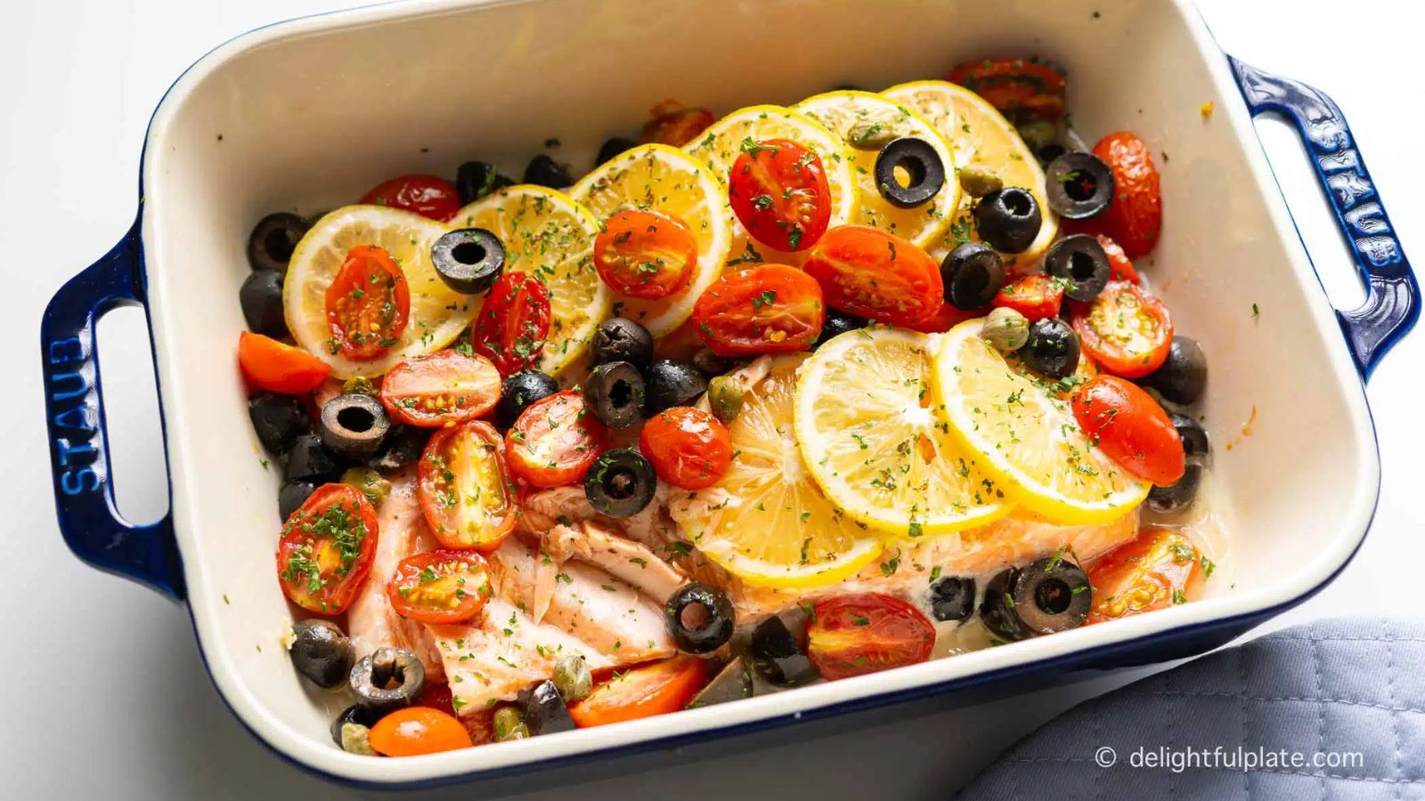 Baked salmon with cherry tomatoes and olives.