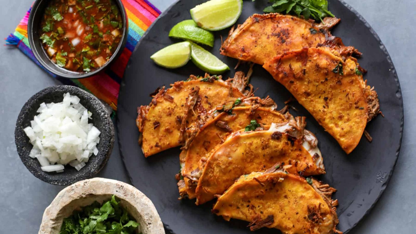 Four birria on a plate.