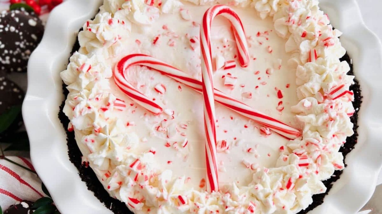 A pie with candy cane on top.