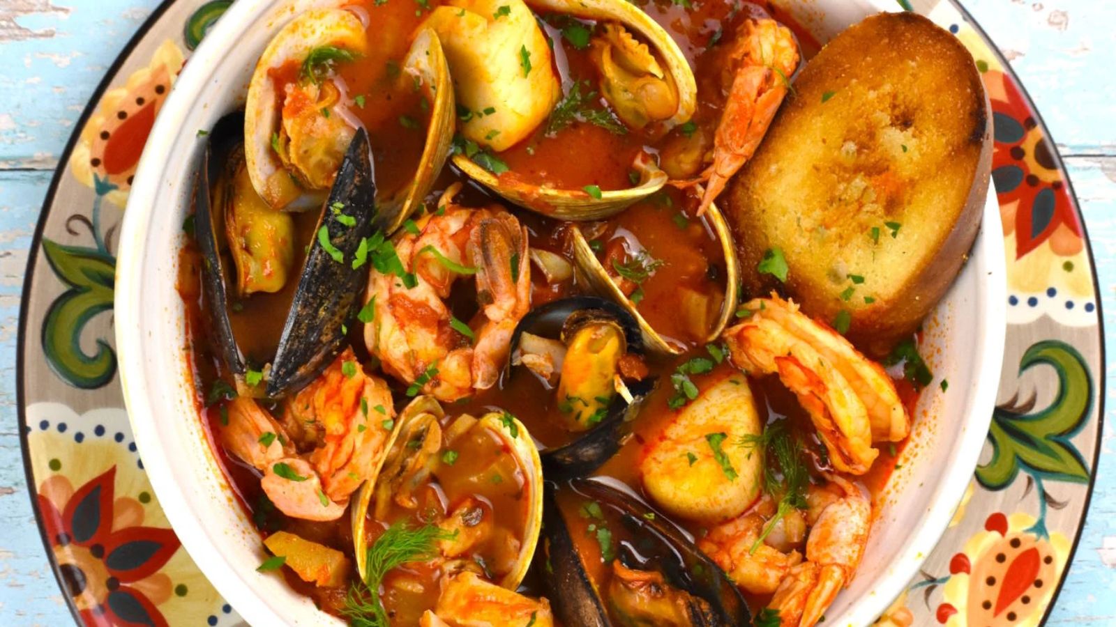 Seafoods with soup in a bowl.