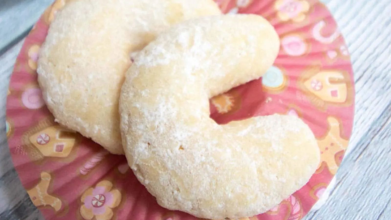 Crescent cookies on a red plate.